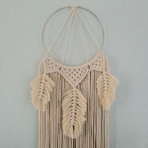 handmade boho macrame wall art hanging wreath in natural on hoop with feathers